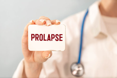 Pills, ampoules and a white card with the text PROLAPSE on a light blue background. Medical conceptの写真素材