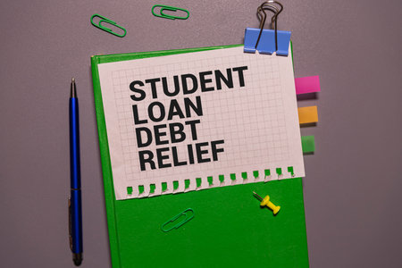 Student loan debt, text words typography written on paper, life and educational concept.の写真素材