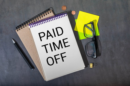 Paid Time Off is shown on a photo using the text.の写真素材