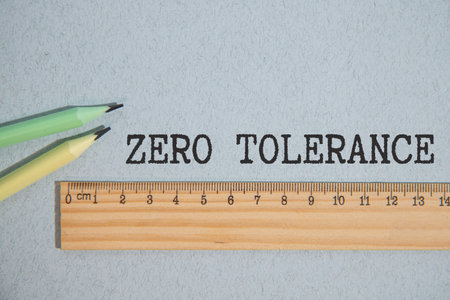 ZERO TOLERANCE. text on white paper on gray background.の写真素材