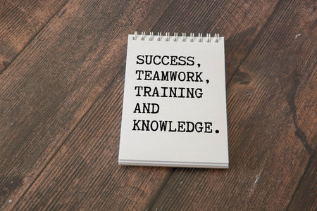 Training Need Assessment, text words typography written on paper against on blue background, life...