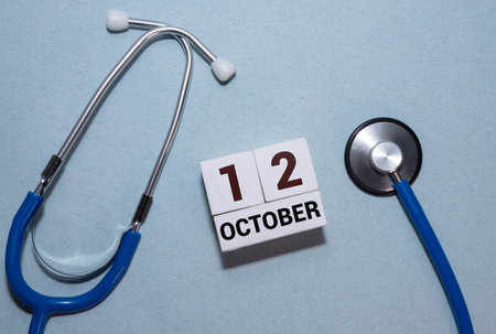 Vintage photo, October 12th. Date of October 12 on wooden cube calendar, copy space for text on boardの写真素材