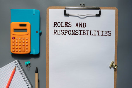 Concept of Roles and Responsibilities write on paperwork isolated on Wooden Table.の写真素材