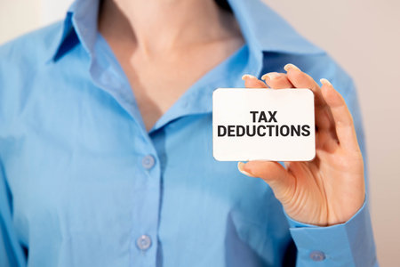 Tax deductions text on the page. on the envelope. working tableの写真素材