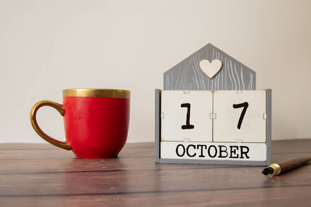Wooden cubes with date on white background.17th of October.