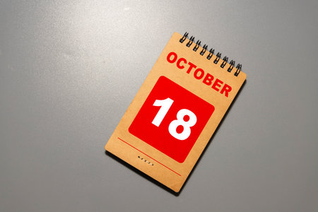 Wooden calendar with the date October 18.