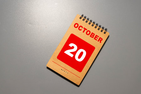 Cube shape calendar for October 20 on wooden surface with empty space for text.の写真素材