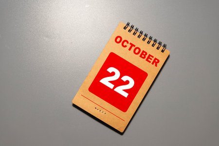 October 22 - from wooden blocks with letters, important date concept, white background random letters aroundの写真素材