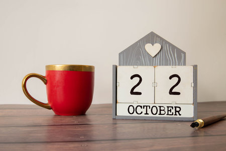 October 22 - from wooden blocks with letters, important date concept, white background random letters aroundの写真素材