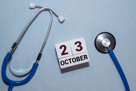 October 23rd. Image of October 23 wooden color calendar on white background. Autumn day. Empty space for textの写真素材