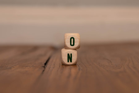 Hand putting wood cube block with BRAND text isolated on white background. Build your Brand. Brand...