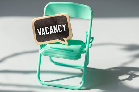 vacancy word is made of wooden blocks lying on the table, concept