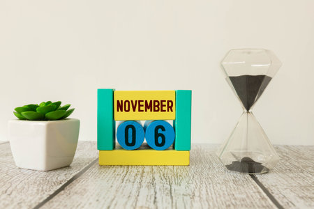 6 November on wooden gray cubes. Calendar cube date 06 November. Concept of date. Copy space for...