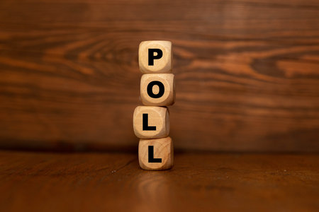 Letter block in word poll on wood background.の写真素材