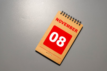 Cube shape calendar for NOVEMBER 8 on tableの写真素材