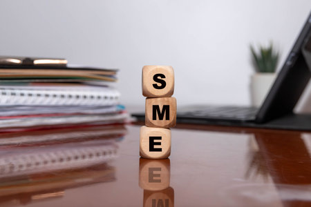 sme acronym on wooden cubes on white background. business conceptの写真素材