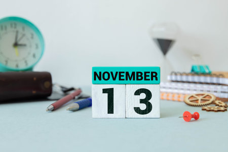 13 November on wooden gray cubes. Calendar cube date 13 November. Concept of date. Copy space for...