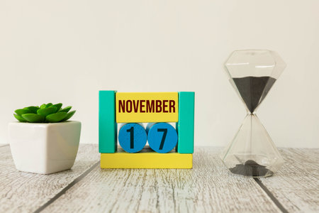 Wood blocks in box with date, day and month 17 November. Wooden blocks calendar.