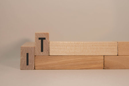 Word war on wooden cubes and sad emoticon closeup.の写真素材