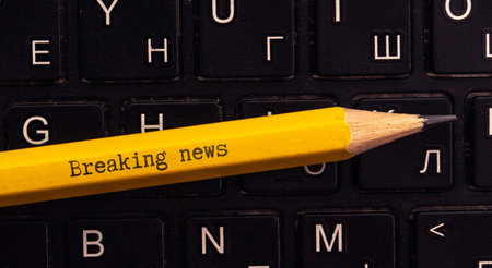 Wooden news sign on a table in an office.の写真素材