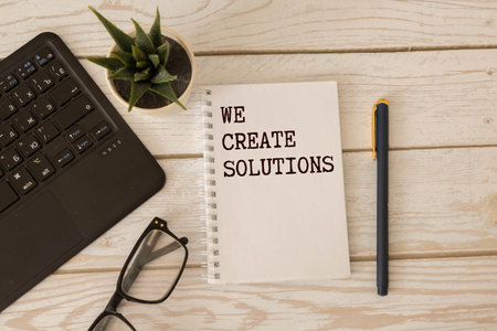 text text Solutions appearing behind torn brown paper.の写真素材