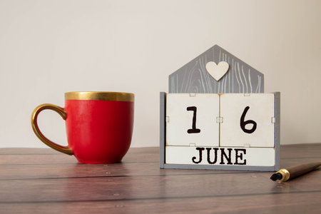 16 June wooden calendar with customizable space for text or ideas. June month conceptの写真素材