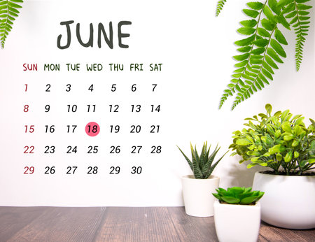 18 June wooden calendar with customizable space for text or ideas. June month conceptの写真素材