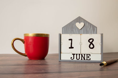 18 June wooden calendar with customizable space for text or ideas. June month conceptの写真素材