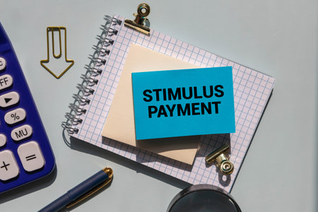 Letters text STIMULUS PAYMENT on blue and yellow background. Motivational Words Quotes Concept. copy space, banner Top view Flat lay seasonal sale, retail, shopping concept. Black friday sale.の写真素材