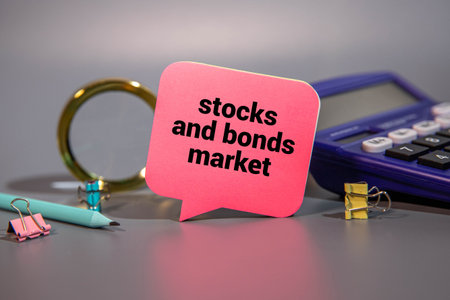 Notebook With Stocks And Bond Market Written On It On A Desk.の写真素材