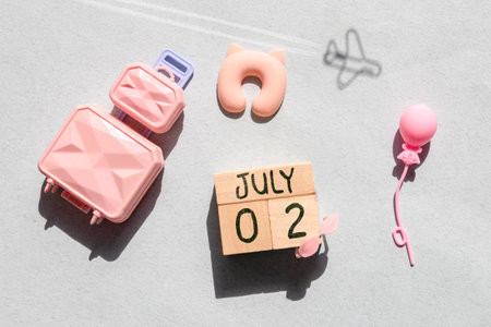 Close up of a wooden perpetual calendar showing the 2nd of July. Shot close up isolated on a white background.の写真素材