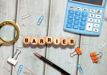 Barrier. Wooden letters on the office desk, informative and communication backgroundの写真素材