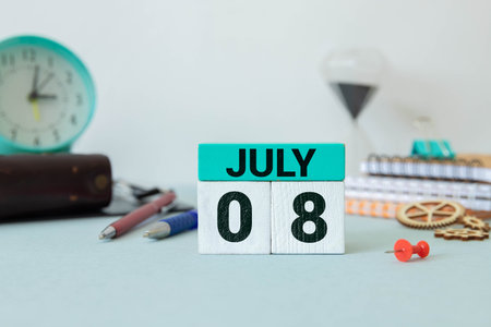 July 8. July 8 on wooden cubes on a wooden background.Photos for the holiday