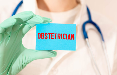 Medical concept. On a black surface, a stethoscope, a notebook, a pen and a blue sticker with the...