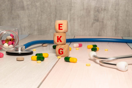 A colored wooden cubes with text EKG. EKG stands for Electrocardiogramの写真素材