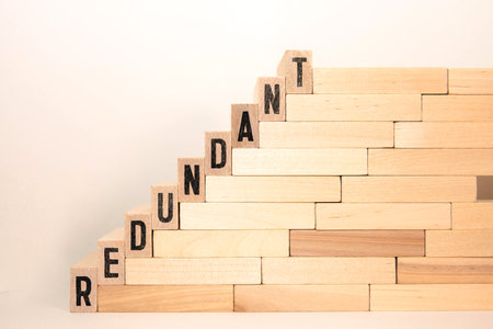 redundancy - cube with letters and words from the computer, software, internet category, wooden cubes.の写真素材