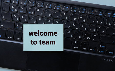 WELCOME TO TEAM text concept write on notebook