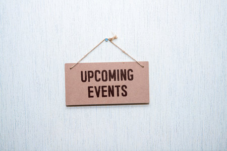 Upcoming Events Text on Paper Card on White Background.
