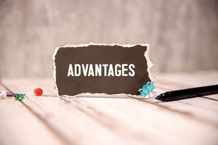 Businessman hand writing advantages with red marker on transparent wipe board, business concept.
