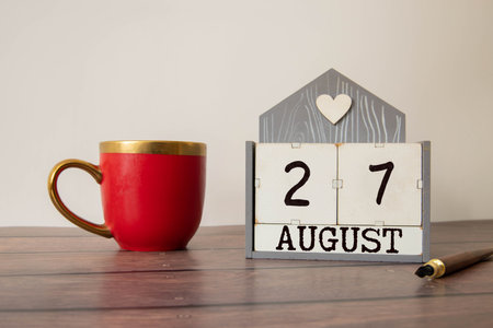 Image of August 27, calendar on wooden background. Summer time.の写真素材