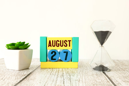 Image of August 27, calendar on yellow background. Summer time.の写真素材