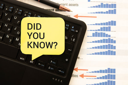 Text DID YOU KNOW on white stickers on notebookの写真素材