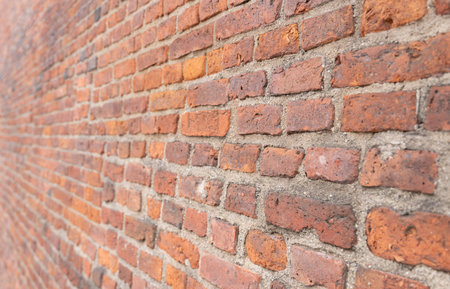 texture dark brick wall of old castle, ancient red stone background.