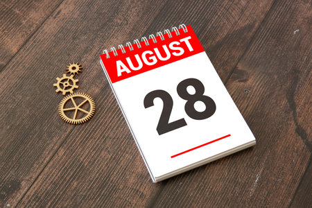 Vintage photo, August 28th. Date of August 28 on wooden cube calendar, copy space for text on board