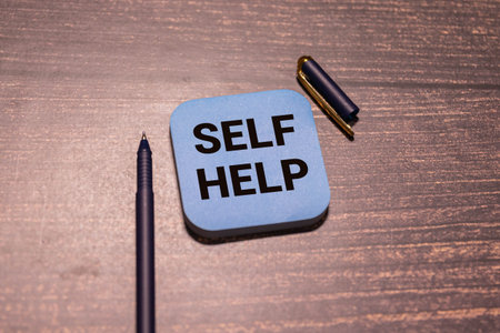Man putting a card with text self help in the pocket
