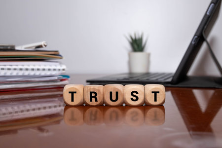 Wooden blocks with the word Trust. Trust relationships between business partners, friends,...