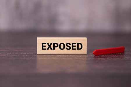 A red brick wall with handwritten inscriptions. It adds character and rustic charm to the unfinished interior of the building space. The image can be used for designs and backgrounds.の写真素材