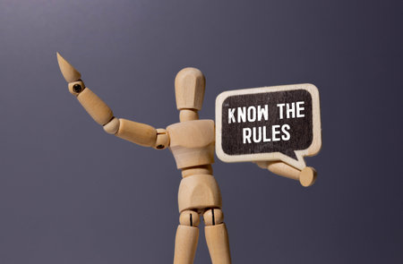 Know the Rules: text on a sticky note. Ideal for Educational Materials, Compliance Guidelines, Business Regulations and Legal Advisories. Blue Note on a Neutral Backgroundの写真素材