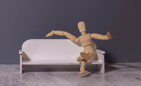 Man sitting on sofa folding arms beside teal pillow at home near dining table, copy space. Modern, relaxation, cozy, interior, minimalism, comfort, homeの写真素材