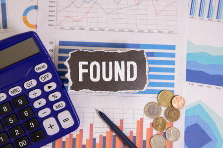 Lost and Found text written on paper card on wooden backgroundの写真素材